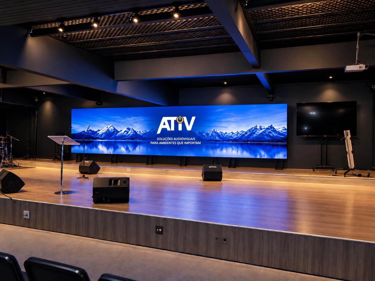Palco com paisagem ao fundo e sistema de áudio e vídeo